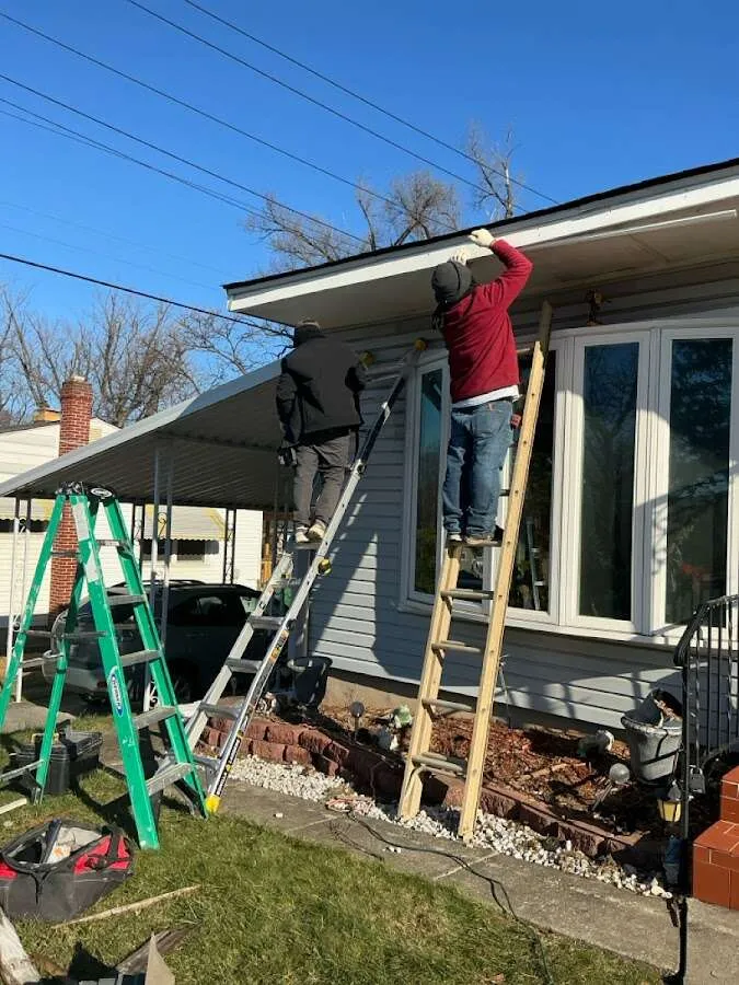 Restoration crew performing exterior repair in Rochester